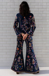 Navy flared pant suit with multi-colour Parsi Gara embroidery and long-line open-front jacket.