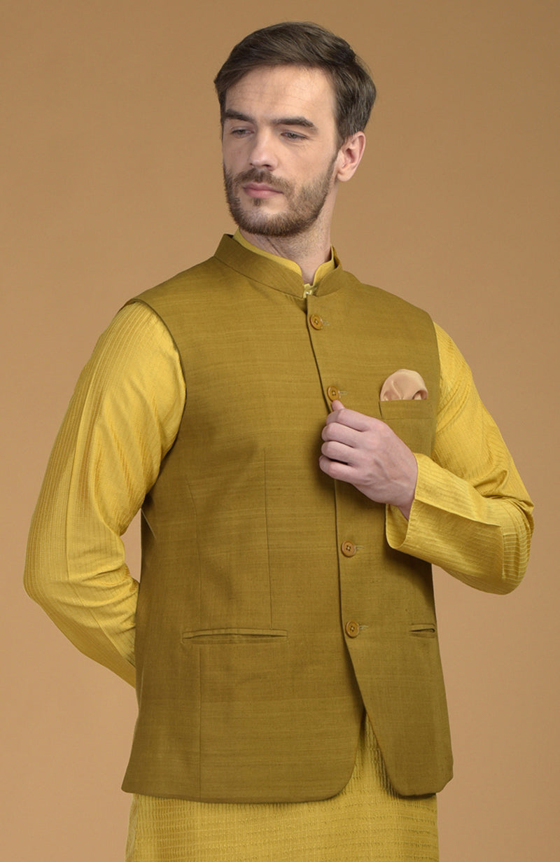 On Her: Mango Mojito Gota Patti & Zari Anarkali Set | On Him: Sunglow Yellow Pintuck Kurta & Mustard Waistcoat Jacket Set