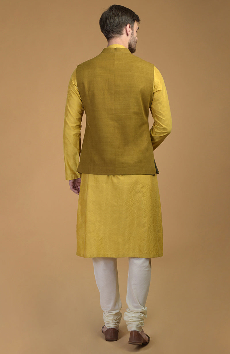 On Her: Mango Mojito Gota Patti & Zari Anarkali Set | On Him: Sunglow Yellow Pintuck Kurta & Mustard Waistcoat Jacket Set