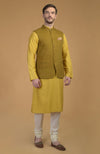 On Her: Mango Mojito Gota Patti & Zari Anarkali Set | On Him: Sunglow Yellow Pintuck Kurta & Mustard Waistcoat Jacket Set
