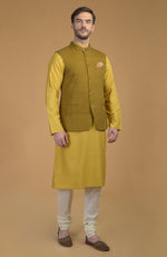 On Her: Mango Mojito Gota Patti & Zari Anarkali Set | On Him: Sunglow Yellow Pintuck Kurta & Mustard Waistcoat Jacket Set