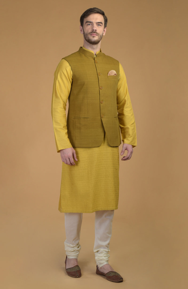 On Her: Mango Mojito Gota Patti & Zari Anarkali Set | On Him: Sunglow Yellow Pintuck Kurta & Mustard Waistcoat Jacket Set