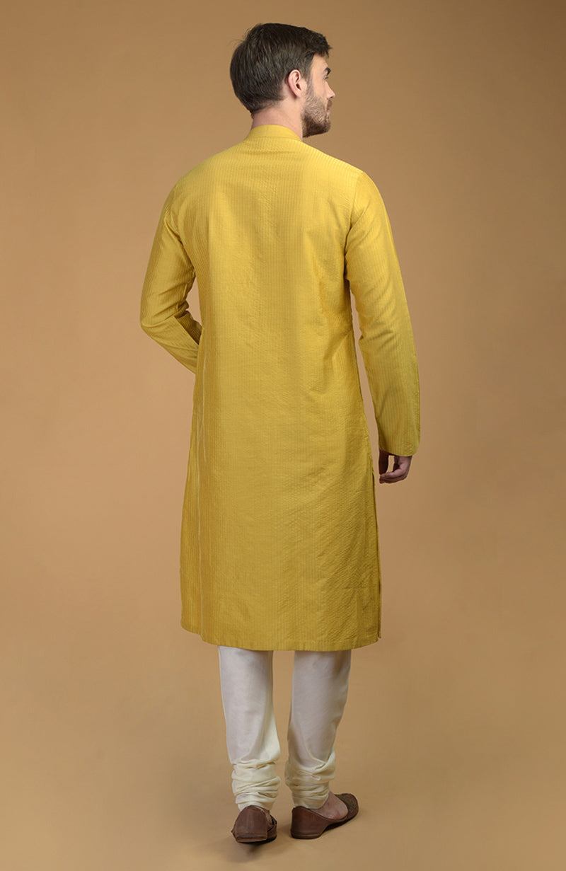 On Her: Mango Mojito Gota Patti & Zari Anarkali Set | On Him: Sunglow Yellow Pintuck Kurta & Mustard Waistcoat Jacket Set
