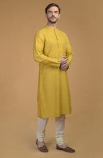 On Her: Mango Mojito Gota Patti & Zari Anarkali Set | On Him: Sunglow Yellow Pintuck Kurta & Mustard Waistcoat Jacket Set