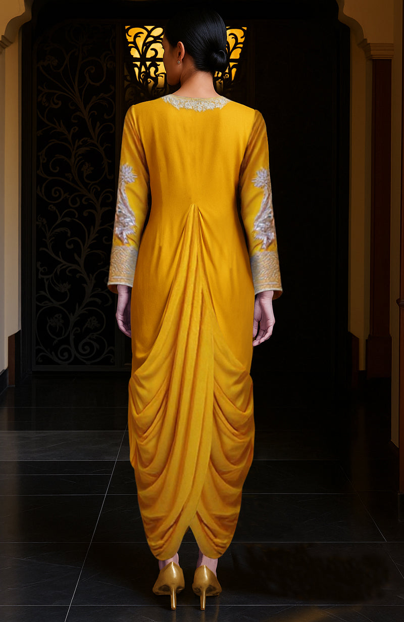 Mustard yellow draped skirt set with silver embroidery and a flowing train.