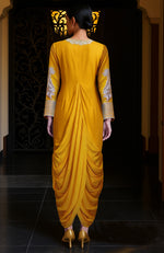 Mustard yellow draped skirt set with silver embroidery on the bodice and sleeves.