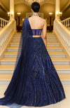Midnight sapphire blue lehenga set with sequined embroidery and a structured corset blouse.