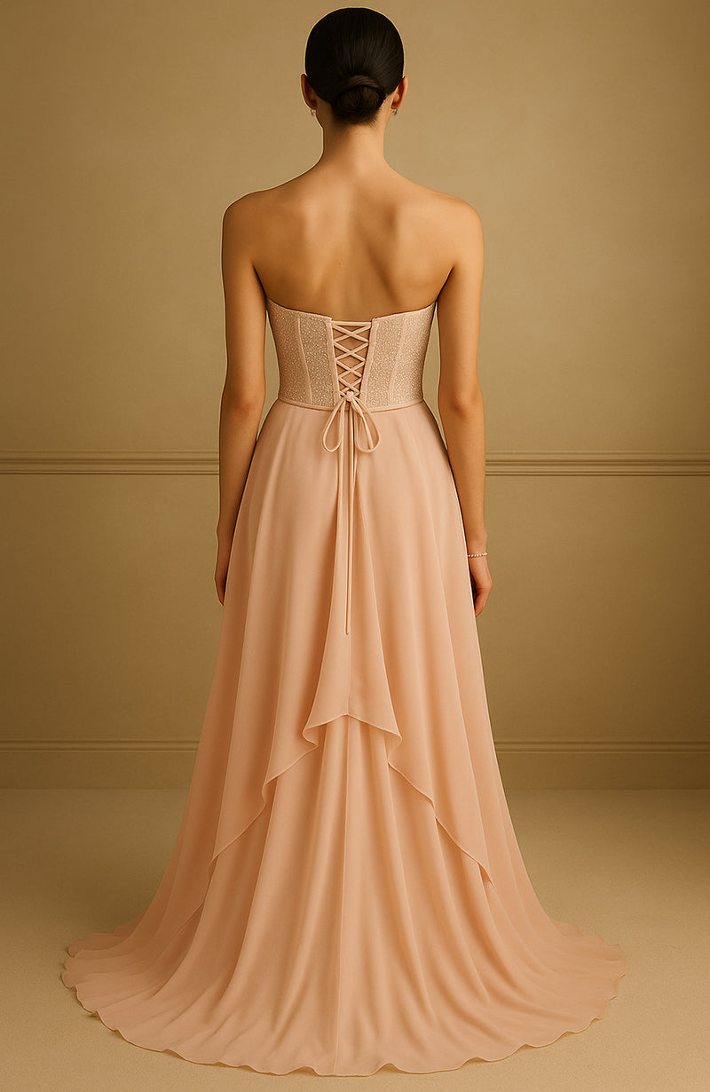 Strapless blush gown with pearl and bead embroidered corset and flowing layered skirt