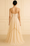 Strapless blush gown with pearl and bead embroidered corset bodice and flowing A-line skirt