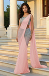 Pre-draped nude-champagne saree with silver sequin embroidered sleeveless blouse and pleated drape