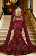 Deep wine maroon mermaid lehenga with heavy sequin embroidery and sheer net cape.