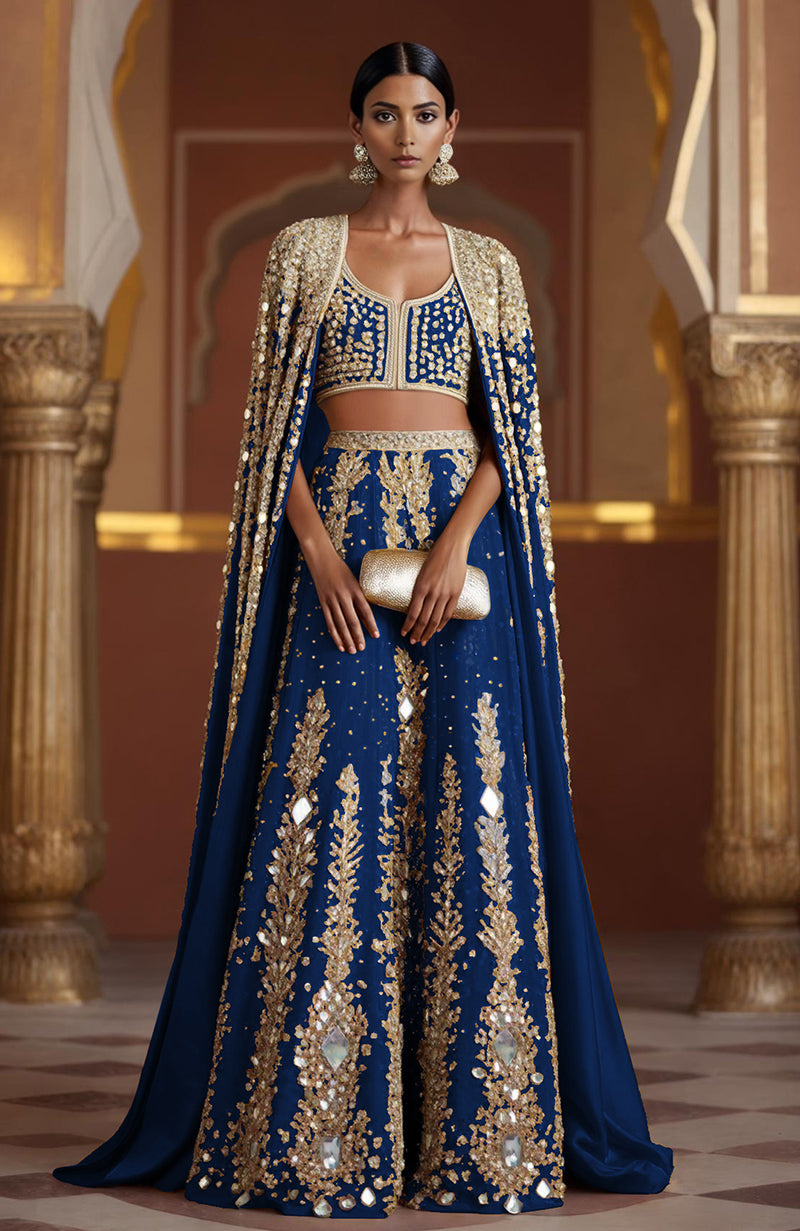 Amber lehenga with mirror embroidery, sequins, and a full-length mirror cape from Jalwa collection.