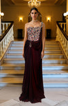 Structured multicolored crystal corset with one-shoulder strap paired with deep maroon saree drape.