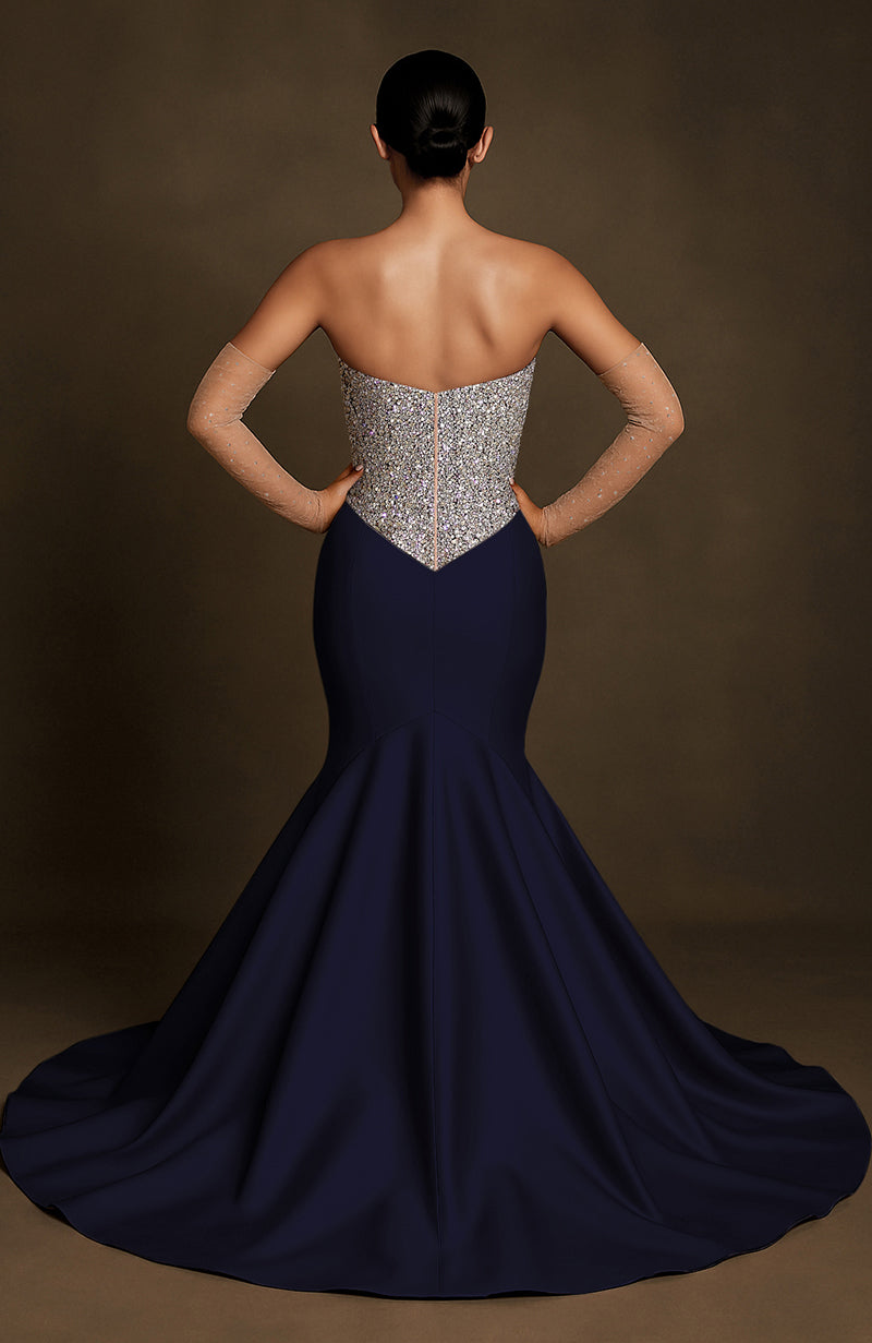 Strapless midnight blue mermaid gown with silver crystal-encrusted bodice and flared floor-length skirt