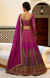Regal fuchsia lehenga set with hand-embroidered zardozi and resham peacock and paisley motifs