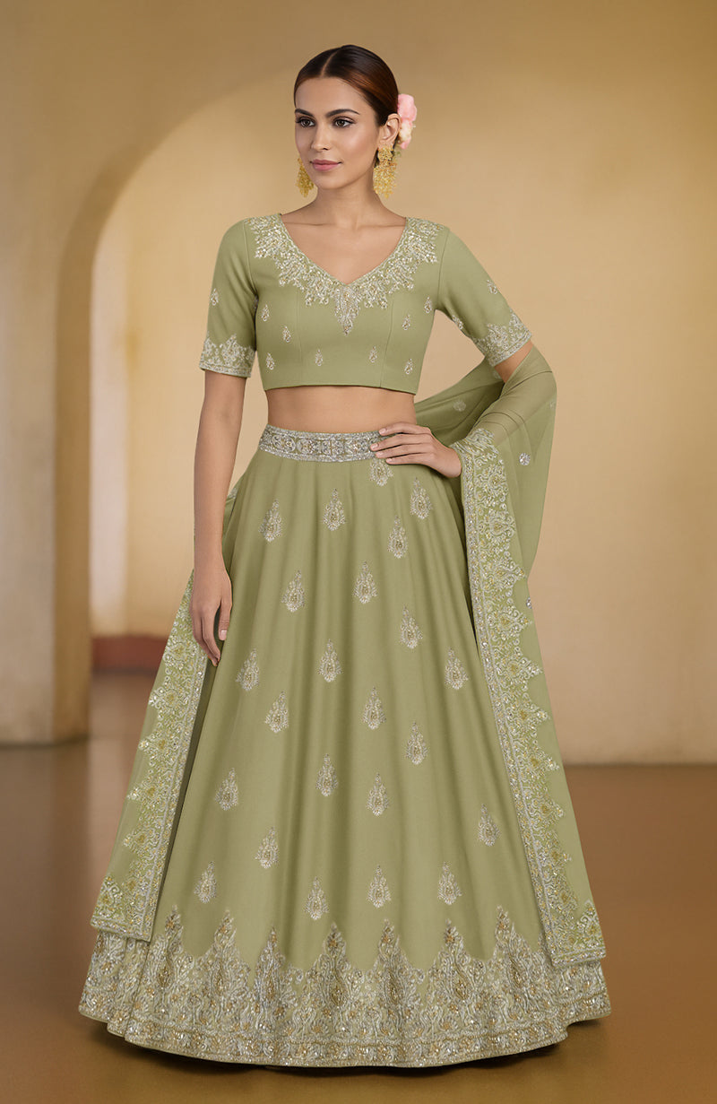 Bog green Kashmiri lehenga set with tilla and zardozi embroidery on blouse, skirt, and dupatta.