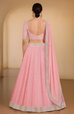 Peony pink lehenga set with gota patti and zardozi embroidery, flared skirt and U-neck blouse.
