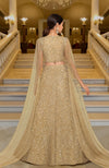 Gold lehenga set with hand-embroidered beads and sequins, deep V-neck blouse, and cape dupatta.