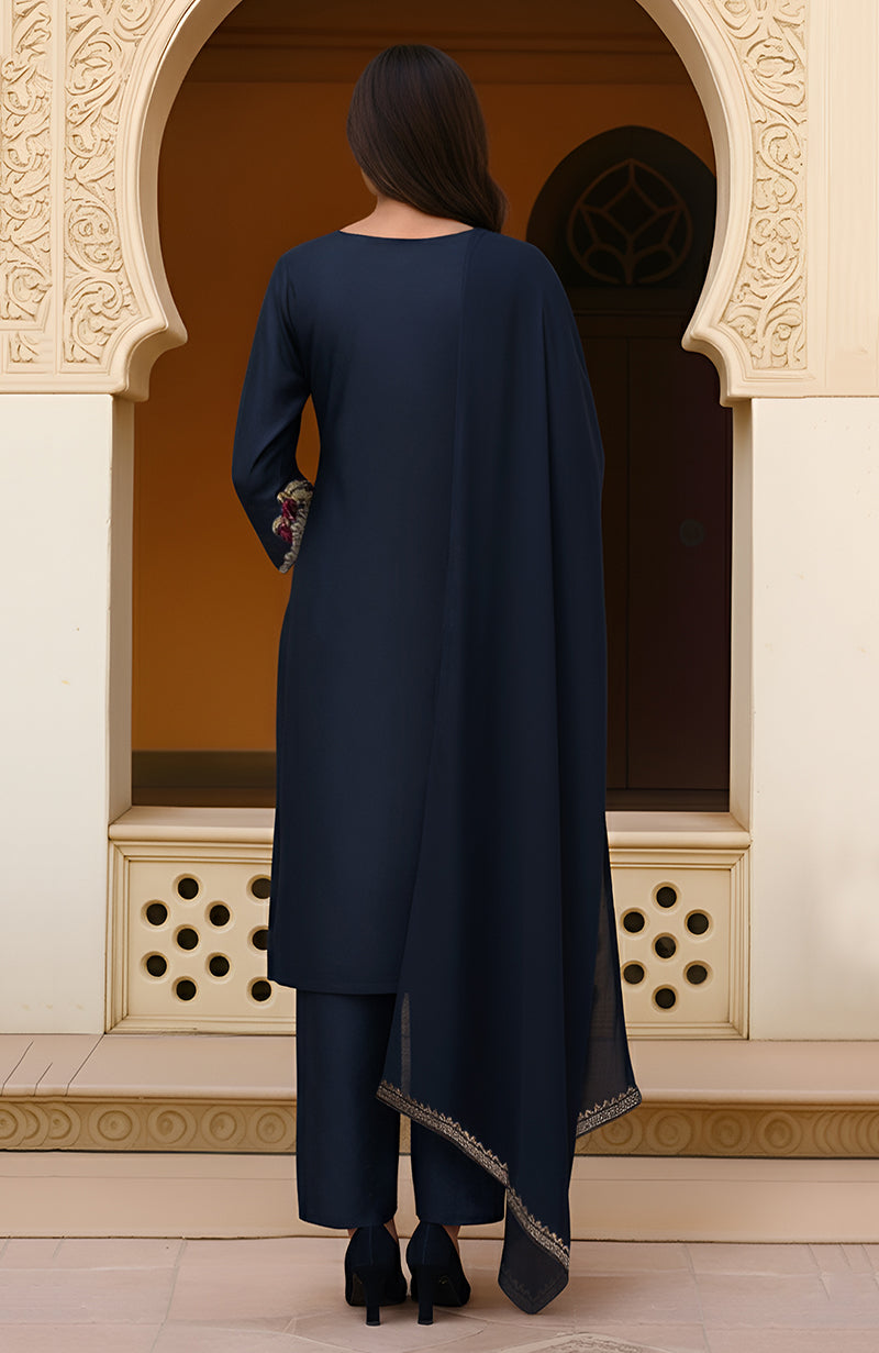 Navy blue kurta set with burgundy and gold floral embroidery, straight pants, and dupatta.