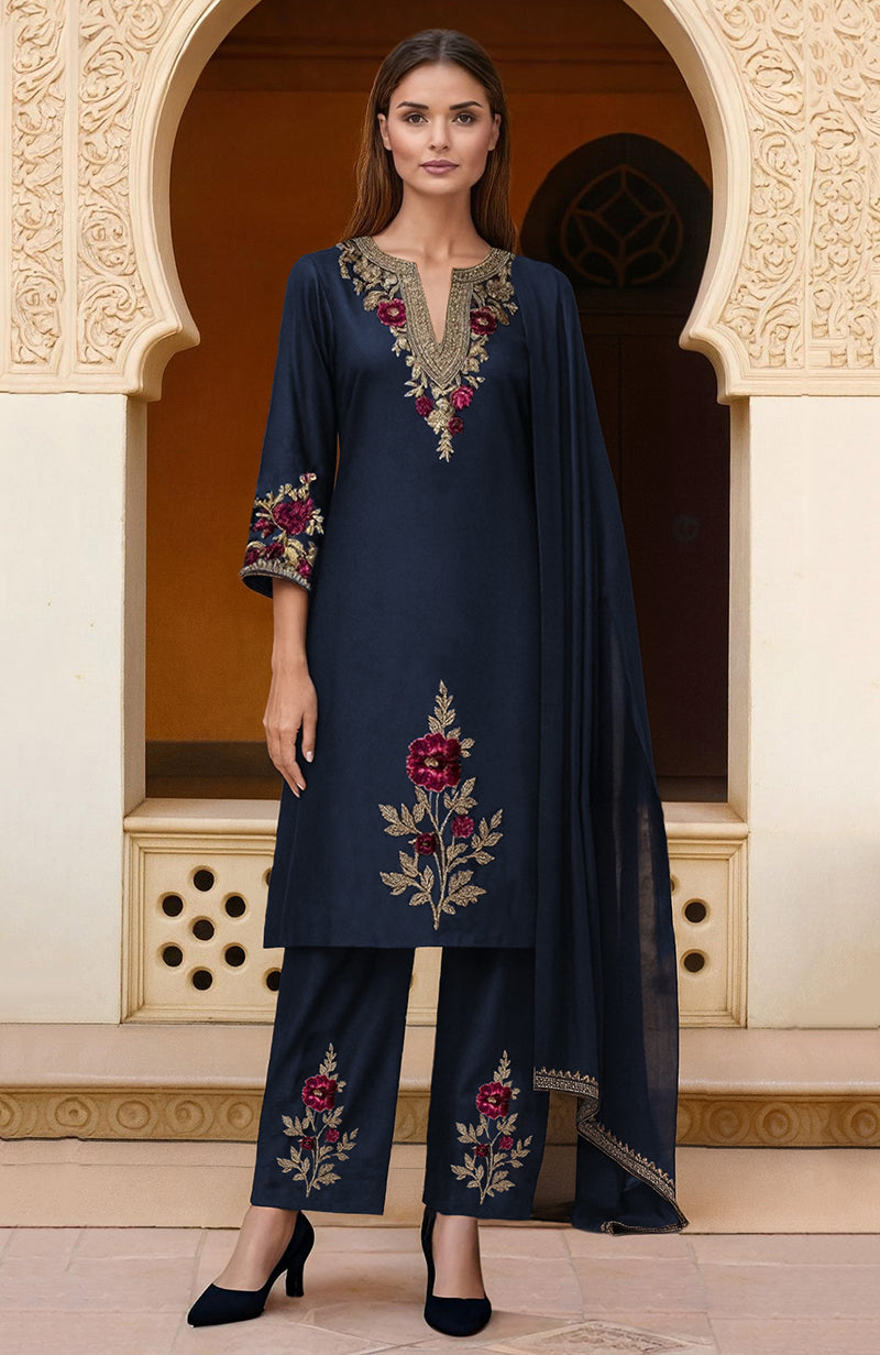 Navy blue kurta set with burgundy and gold floral embroidery, straight pants, and dupatta.