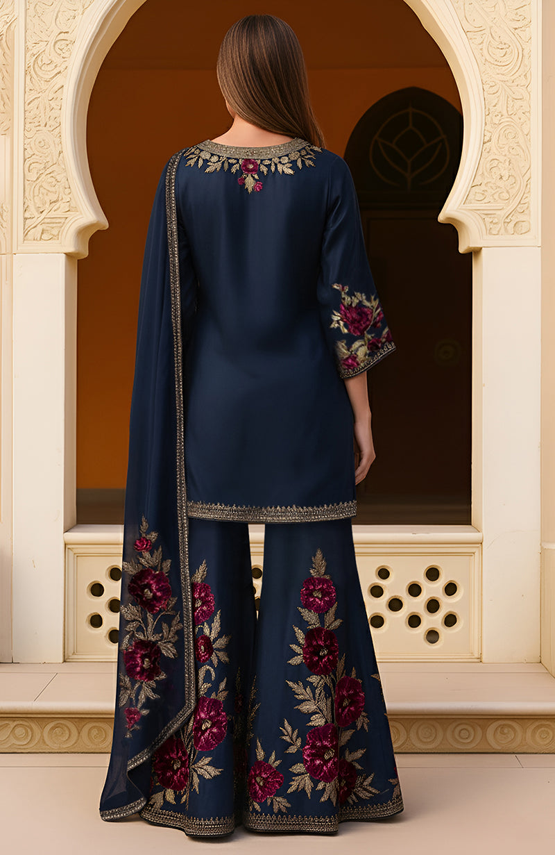 Navy blue sharara set with gold and burgundy floral embroidery and matching dupatta.