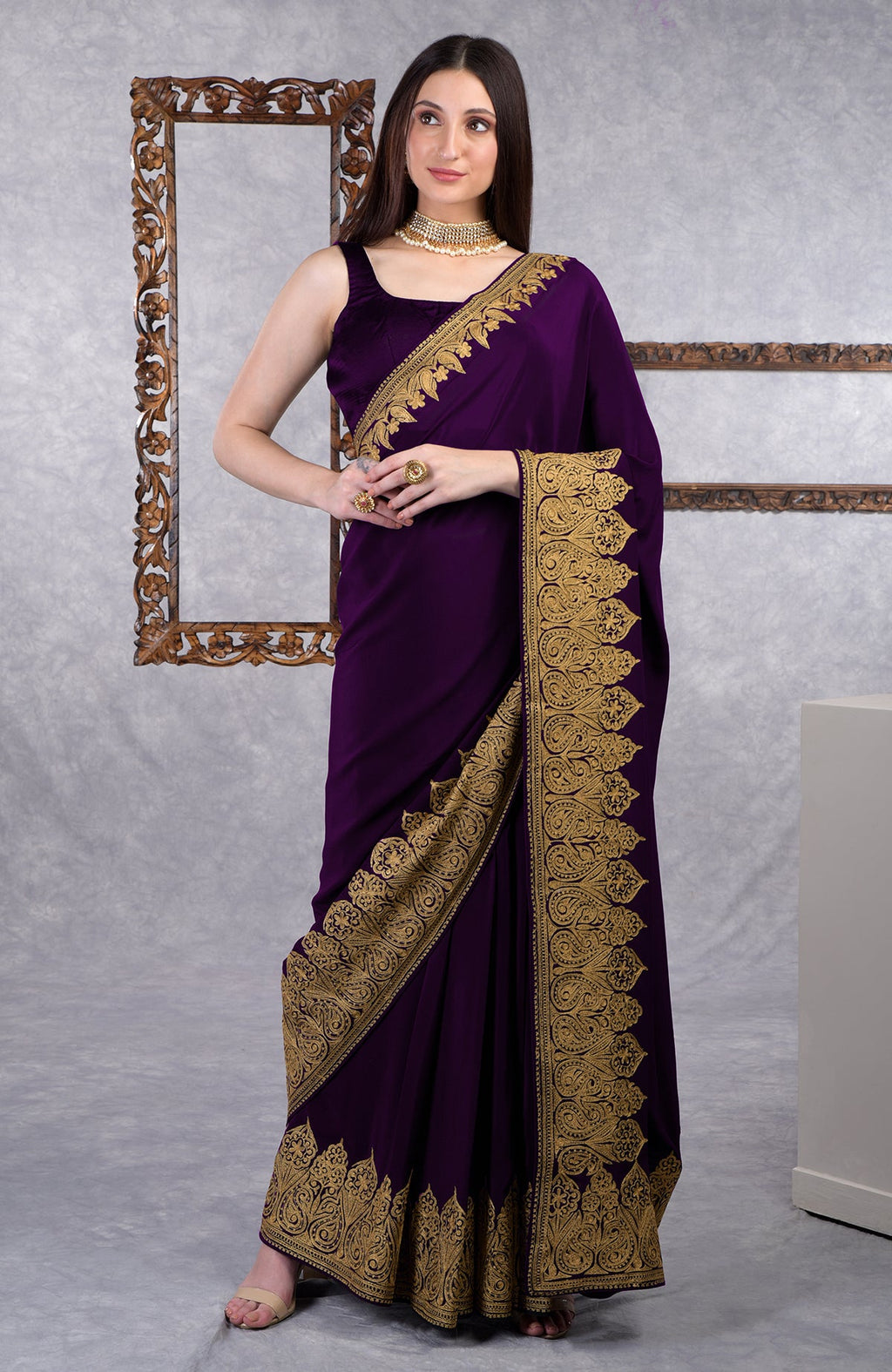 Dark plum crepe saree with gold Kashmiri tilla aari floral and paisley embroidery border.